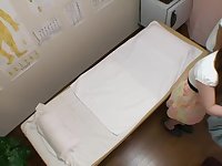 Adorable Japanese babe gets fingered in voyeur massage clip